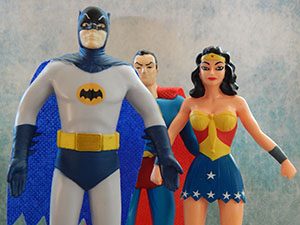 Batman, Superman, and Wonder Woman figurines